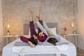 Couple relaxing in bed in the morning Royalty Free Stock Photo