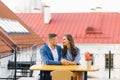 Beautiful couple in love is sitting at a table in an outdoor cafe on a date Royalty Free Stock Photo