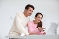 Beautiful couple in love using laptop choose online shopping at home