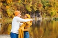 Beautiful couple in love walking in autumn park. Happy young couple having fun together outdoors. Love, relationship and fashion Royalty Free Stock Photo