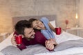 Couple drinking coffee in bed in the morning Royalty Free Stock Photo