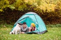 Beautiful couple lying in tent, camping in autumn nature Royalty Free Stock Photo