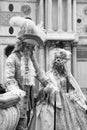 Beautiful couple of masks at St. Mark square during the carnival of Venice. Italy