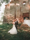 Beautiful couple of newlyweds on a walk near the old manor Royalty Free Stock Photo