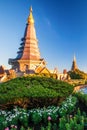 Beautiful couple pagodas and flowers garden at sunset, scenery landscape of tropical garden on the top of Doi Inthanon mountain. Royalty Free Stock Photo