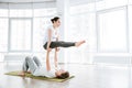 Beautiful couple practicing acro yoga