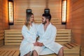 Beautiful couple relaxing in infrared sauna during wellness weekend Royalty Free Stock Photo