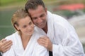 Beautiful couple resting with bathrobe at thalasso resort
