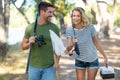 beautiful couple with rods going fishing Royalty Free Stock Photo