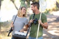 beautiful couple with rods going fishing Royalty Free Stock Photo
