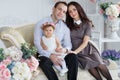 Beautiful couple with a small daughter home the portrait Royalty Free Stock Photo