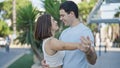 Beautiful couple smiling confident standing together dancing at park Royalty Free Stock Photo