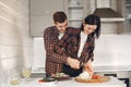 Beautiful couple spend time in a kitchen