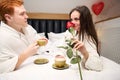 Beautiful couple spending time together in contemporary apartment Royalty Free Stock Photo