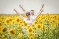 Beautiful couple in a sunflower field