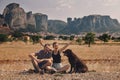 Beautiful couple of tourists in Greece with the Meteora Monaster