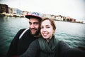 Beautiful couple of tourists take travel selfie