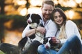 Beautiful couple walking dogs and bonding in nature Royalty Free Stock Photo