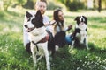 Beautiful couple walking dogs and bonding in nature Royalty Free Stock Photo