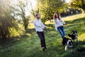 Beautiful couple walking dogs and bonding in nature Royalty Free Stock Photo