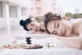 Beautiful couple woman relaxing massage treatment at beauty spa. Royalty Free Stock Photo