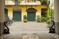 Beautiful courtyard with archway, plants, Parking space for bicycles, a traditional Italian courtyard. Focus on entry