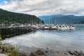 Beautiful Cove with Moored Boats and Mountains in Background Royalty Free Stock Photo