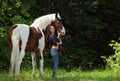 Beautiful cowgirl bareback ride her horse in woods Royalty Free Stock Photo
