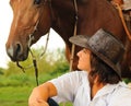 Beautiful cowgirl with her horse Royalty Free Stock Photo