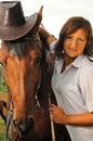 Beautiful cowgirl with her horse Royalty Free Stock Photo