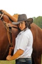 Beautiful cowgirl with her horse Royalty Free Stock Photo