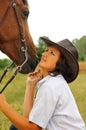 Beautiful cowgirl with her horse Royalty Free Stock Photo