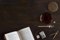 Beautiful cozily flat lay of cup of tea, book, cookie and spices on wooden floor Royalty Free Stock Photo