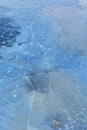 A beautiful cracked ice patterns on the frozen lake surface during winter in Latvia. Royalty Free Stock Photo