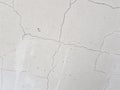 Concrete in cracks or cracks in plaster