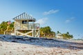 Beautiful Crandon Park Beach located in Key Biscayne in Miami, Florida, USA. Palms, white sand and security house Royalty Free Stock Photo