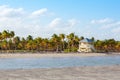 Beautiful Crandon Park Beach located in Key Biscayne in Miami, Florida, USA. Palms, white sand and security house Royalty Free Stock Photo