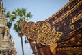 Beautiful craved naga pattern on the rafter and gable of the Tha