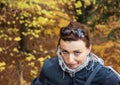 Beautiful crazy brunette posing in autumn outdoors, vibrant colo