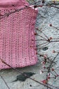 Beautiful crocheted old pink handbag before the wall in autumn