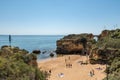 Beautiful crowded beach view in Lagos, Portugal, on a sunny day