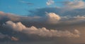 Beautiful cumulonimbus stormy rain cloud formations in Summer sunset sky with dramatic moody color and texture Royalty Free Stock Photo