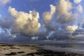 Beautiful cumulus clouds lit by the sunrise sun. Water in gaseous form