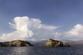 Beautiful cumulus clouds over sea, travel background Royalty Free Stock Photo