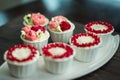 Beautiful cup cakes flowers from butter cream, in red and pink colour. Suitable for Birthday, Anniversary, Valentine Day. Royalty Free Stock Photo