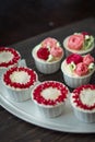 Beautiful cup cakes flowers from butter cream, in red and pink colour. Suitable for Birthday, Anniversary, Valentine Day. Royalty Free Stock Photo