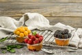 beautiful cupcakes with berries on wooden background Royalty Free Stock Photo