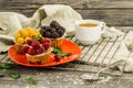 beautiful cupcakes with berries on wooden background in red plate Royalty Free Stock Photo