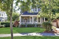 Beautiful curb appeal. American house with well kept front yard.