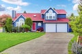 Beautiful curb appeal with blue exterior paint and red roof. Royalty Free Stock Photo